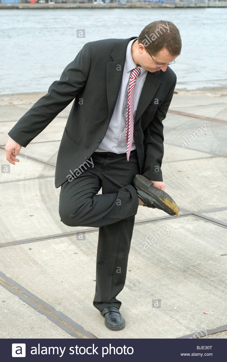 man-stepping-in-dog-shit-BJE30T.jpg