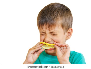 boy-eating-fresh-lemon-isolated-260nw-669629614.jpg
